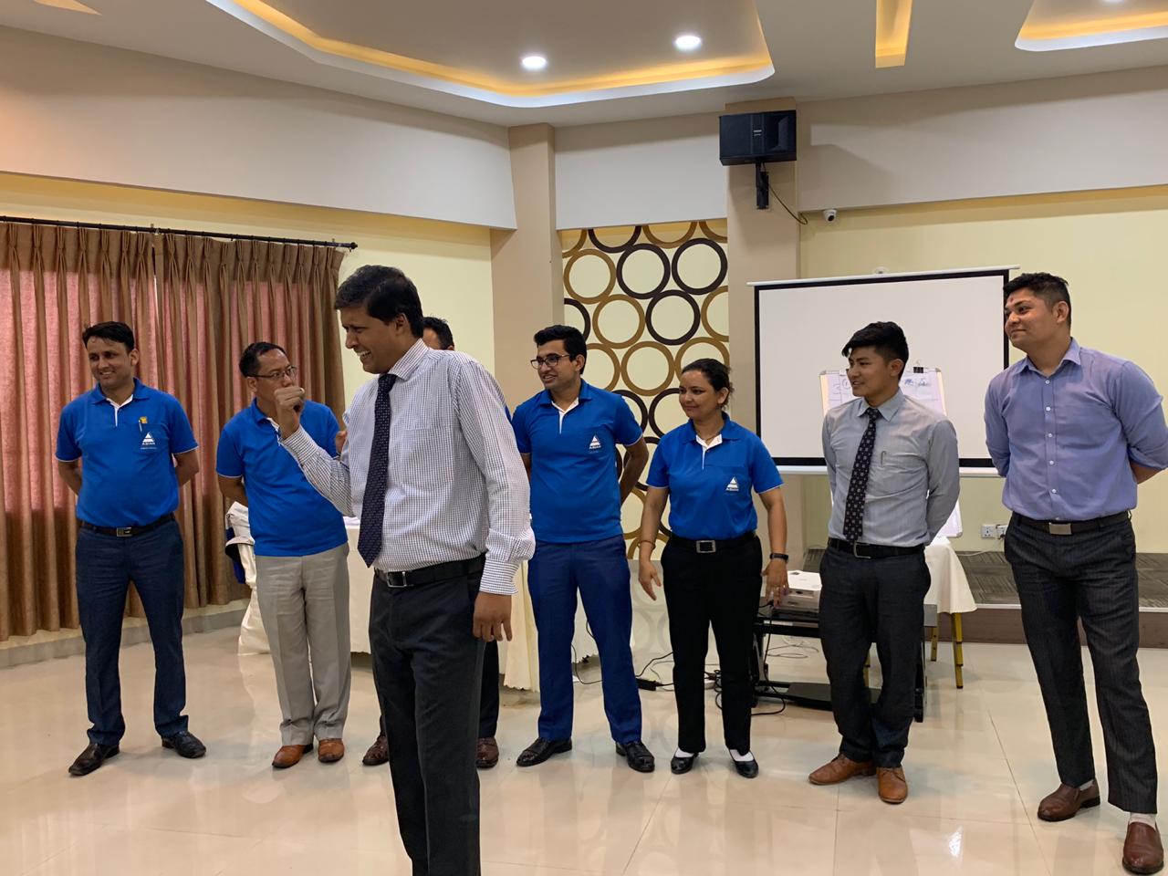 Managers participating in an interactive group activity during a Mind Makers leadership training program